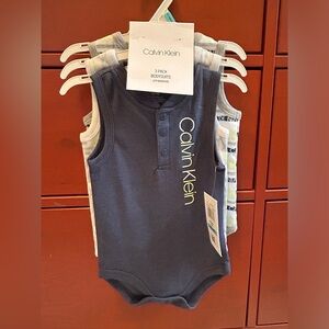 Cabin Klein 3 pack Body suits size 6-9 months NEW